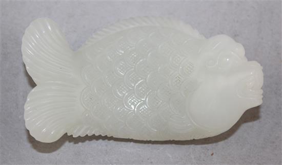 A Chinese white jade carving of dragon-fish, 8.5cm.